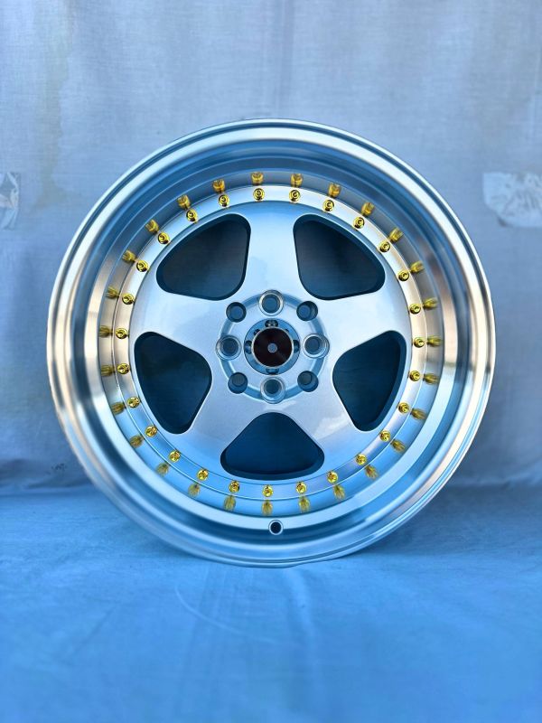 6089R	R16 9J	ET15	5x100 / 5x114,3	73,1	Silver Polish Lip Gold Rivets