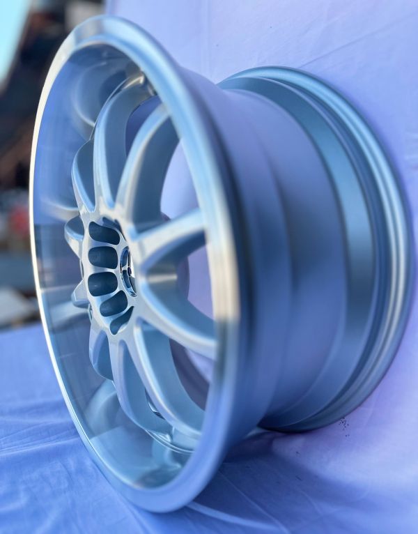 L409	R18 8J	ET27	5x100 / 5x114,3	73.1	sliver/machine lip